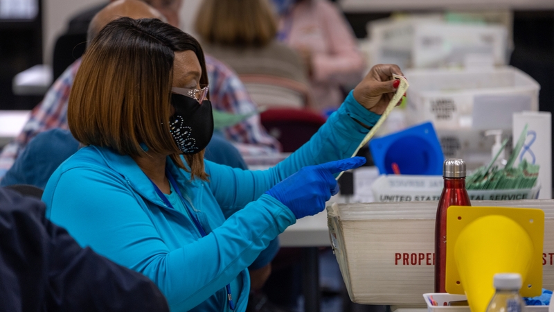 Election workers sort ballots at the Maricopa County Tabulation and Election Centre in Phoenix, Arizona
