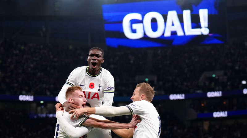 Spurs players mob Rodrigo Bentancur after his secured a dramatic comeback for the home side