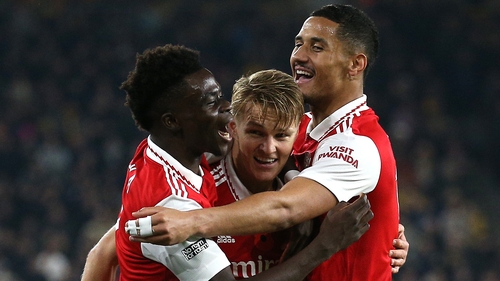 Odegaard (C) celebrates with Saka and Saliba