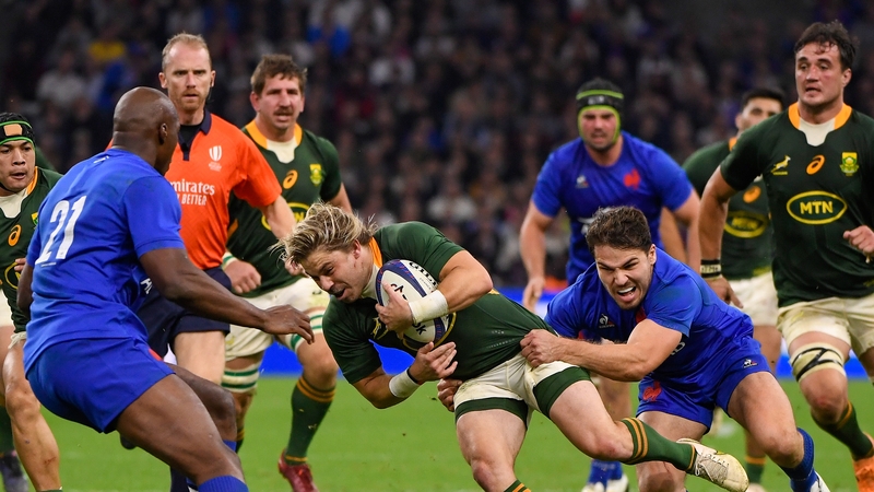Francois de Klerk of South Africa is tackled