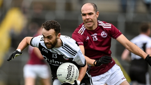 Conor Laverty attempts to get away from the attentions of Paul Finlay