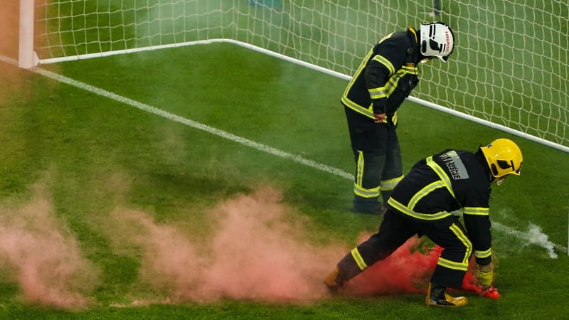Members of the Dublin Fire Brigade had to remove flares from the pitch