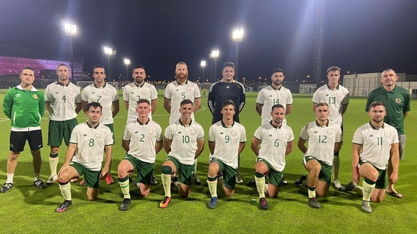 The Qatar Irish football team with co-managers Niall Keogh and Ronan Kelly
