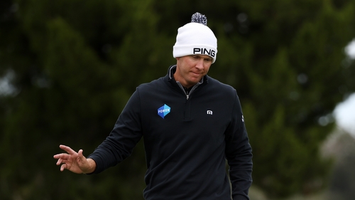 Power reacts to his putt on the eighth green