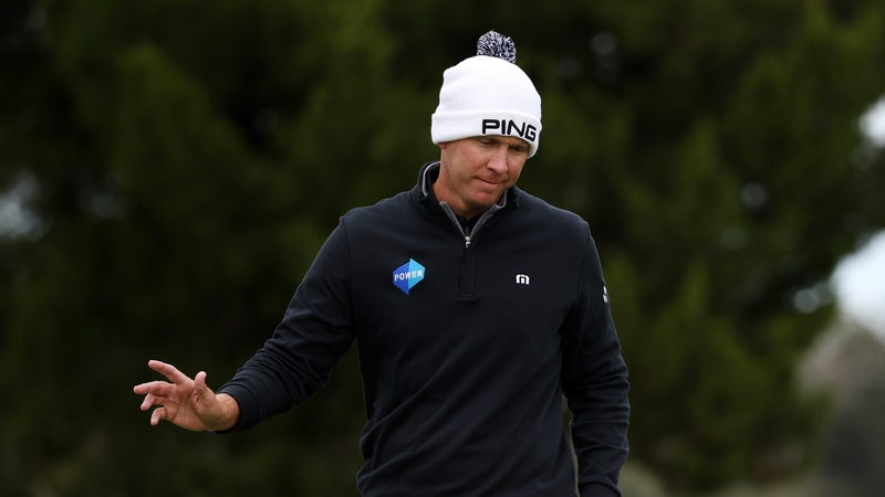 Power reacts to his putt on the eighth green