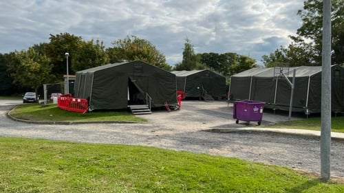 Military tents are being used to house refugees at a number of sites