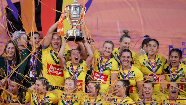 Samantha Bremner of Australia lifts the Women's Rugby League World Cup trophy