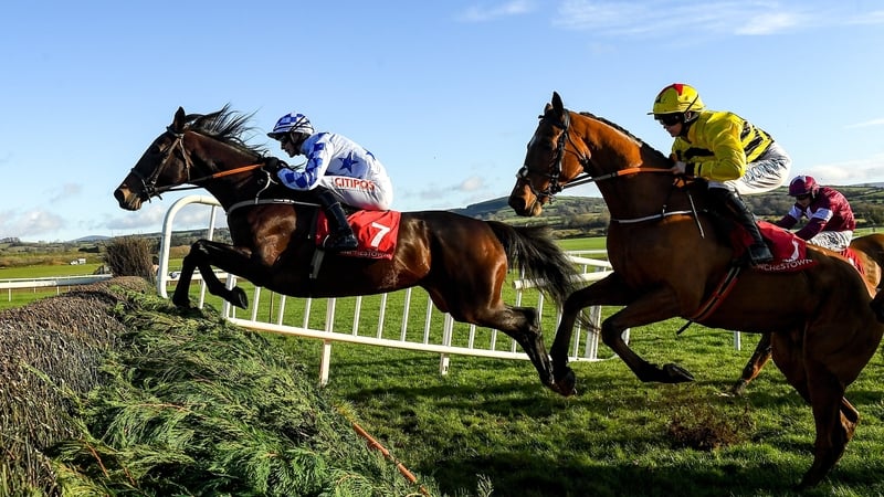 Darrens Hope, with Danny Mullins up, leads the field over the fourth on their way to winning