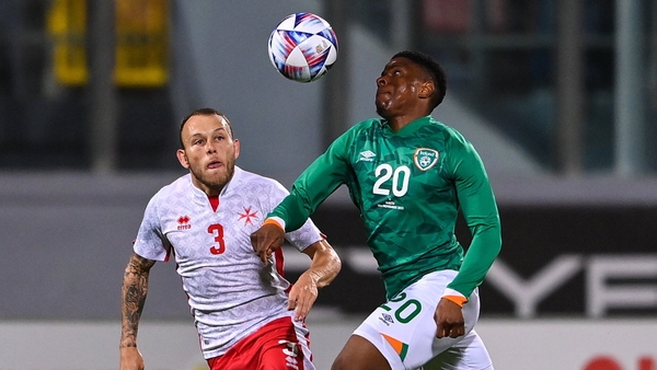 Chiedozie Ogbene (R) takes on Ryan Camenzuli