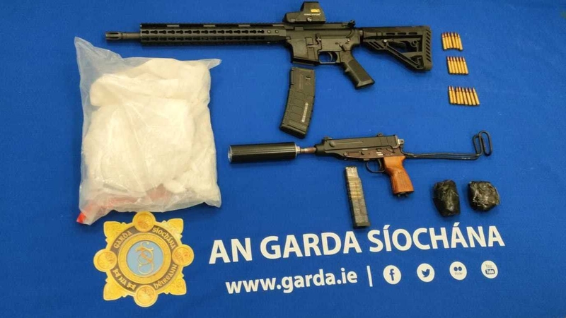 An assault rifle and a machine pistol with a silencer were among the items recovered