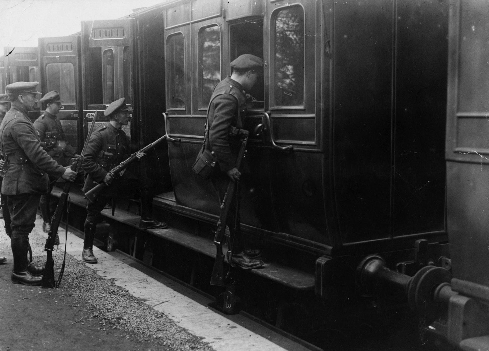 April 1923: National Army soldiers searching a train with bayonets at the ready on Easter Monday in Dublin during the Civil War. Photo: Walshe/Topical Press Agency/Getty Images)
