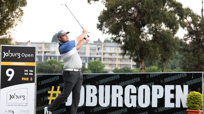 Dan Bradbury of England tees off on the ninth hole