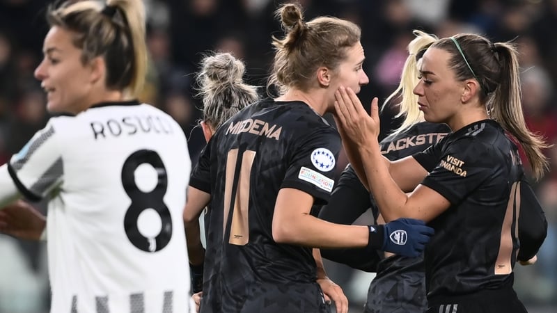Katie McCabe celebrates with Arsenal goalscorer Vivianne Miedema