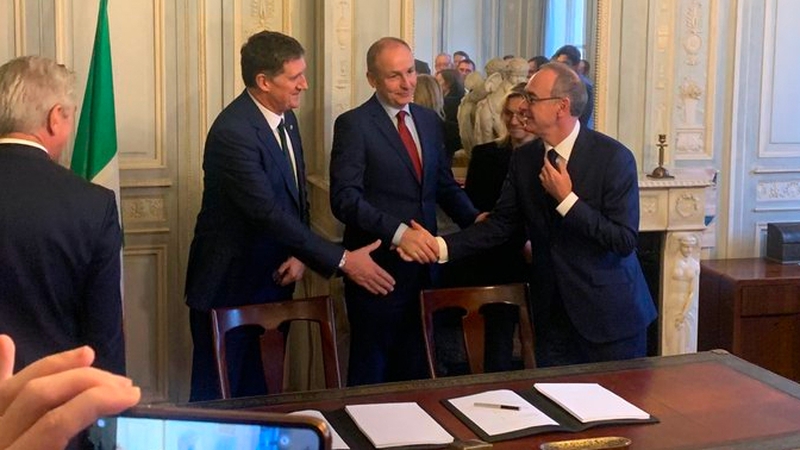 Eamon Ryan and Micheál Martin with Xavier Piechacyzk at the signing ceremony in Paris