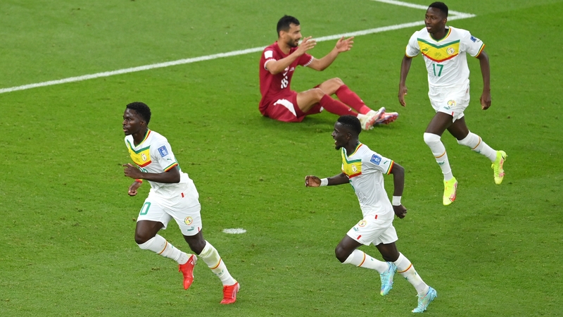 Bamba Dieng of Senegal celebrates with team-mates after scoring their team's third goal