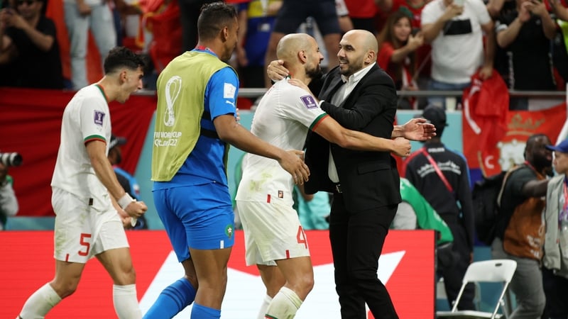 Walid Regragui celebrates victory with his players