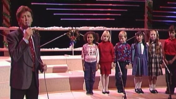 Dickie Rock sings with Billie Barry Kids 'From A Distance' (1987)