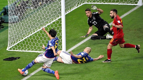 Kaoru Mitoma of Japan crosses the ball for his side's second goal