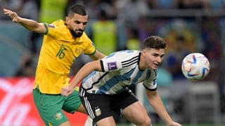 Australia's Aziz Behich battles with Julian Alvarez for possession