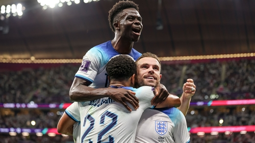 Jordan Henderson celebrates his goal with Jude Bellingham and Bukayo Saka