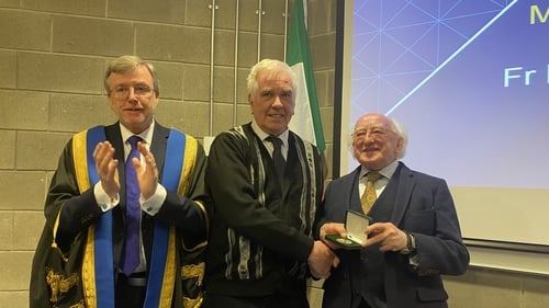 President Michael D Higgins presented Fr McVerry the McAuley Medal from Mary Immaculate College