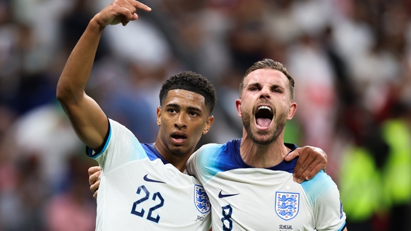 Jude Bellingham (L) set up a goal for Jordan Henderson in England's World Cup win over Senegal last year