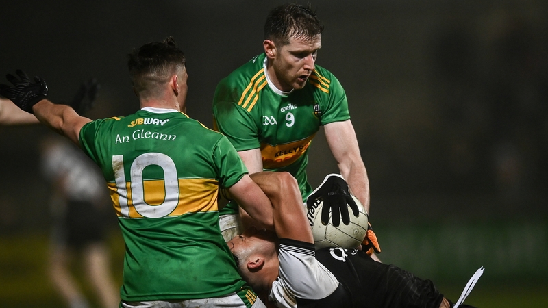 Dylan Ward of Kilcoo is tackled by Eunan Mulholand, left, and Emmet Bradley during last year's Ulster semi-final