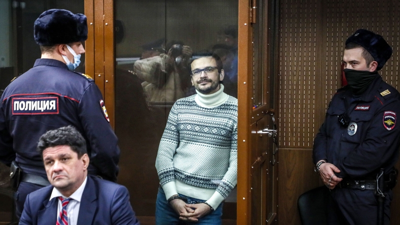 Russian opposition figure Ilya Yashin inside a defendants' box at the Meshansky district court in Moscow