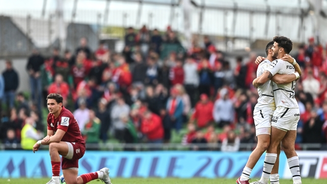 7 May: Romain Ntamack and Matthis Lebel of Toulouse celebrate as Joey Carbery of Munster is dejected during the 'place kick competition' to decide the winner of the Heineken Champions Cup quarter-final at the Aviva Stadium
