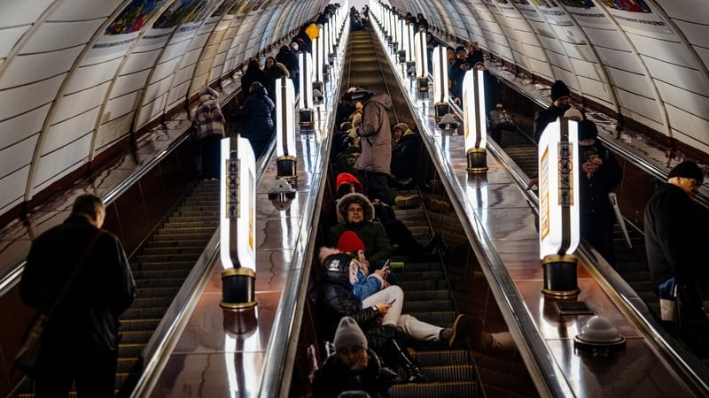 Civilians take shelter inside a metro station during an air raid alert in the centre of Kyiv today