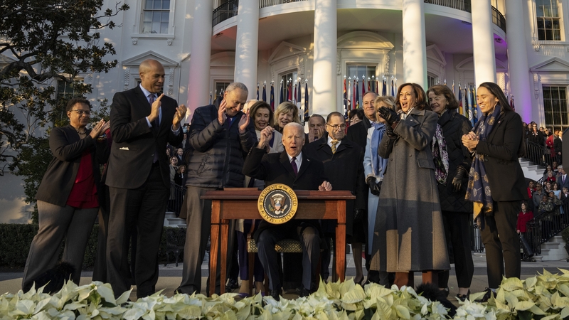 Joe Biden signed the bill on the White House law in front of a crowd of lawmakers and advocates