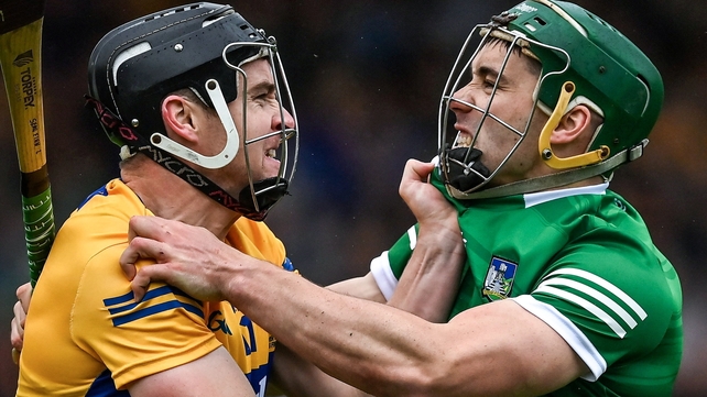 5 June: Tony Kelly and Seán Finn getting to grips with things during the Munster hurling final