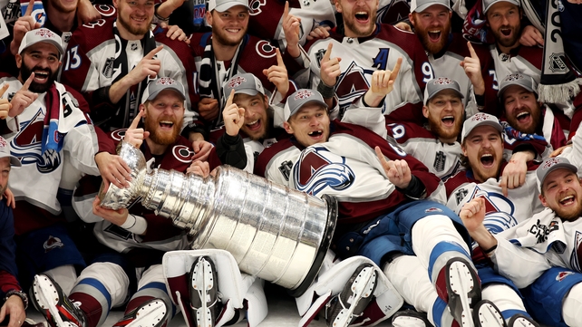 26 June: Colorado Avalanche coaches and players pose for a photo after defeating the Tampa Bay Lightning to win the Stanley Cup
