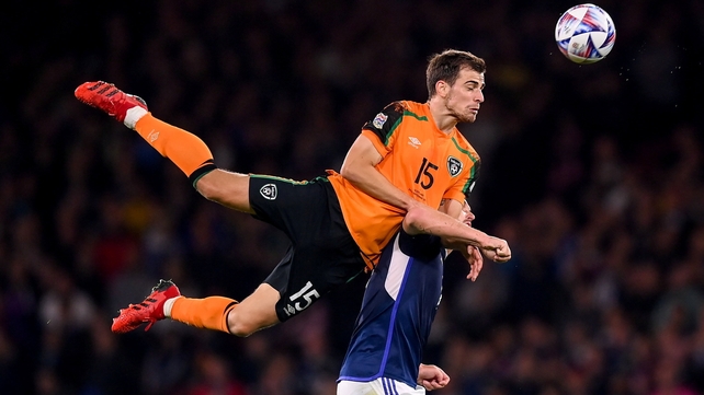 24 September: Jayson Molumby rises high against John McGinn of Scotland during the Nations League game at Hampden Park