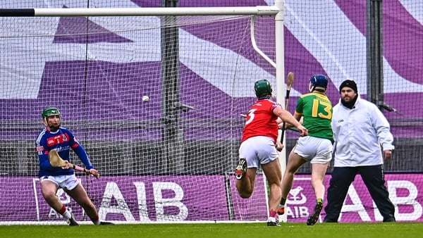 Keelan Molloy with the decisive goal for the Antrim champions