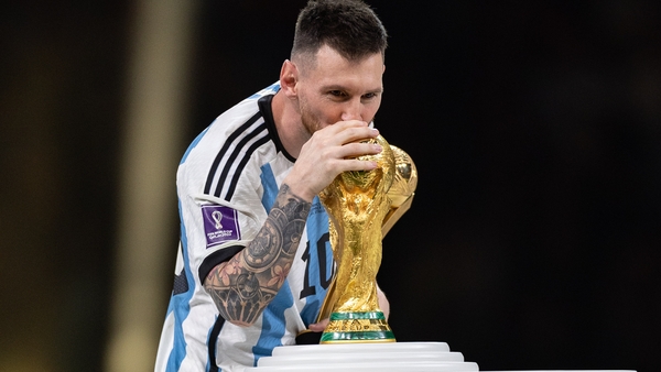 Lionel Messi kisses the World Cup following the final