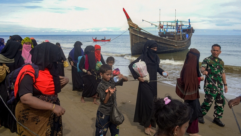 After surviving a five-week sea journey, Rohingya migrants disembark at North Aceh, Indonesia on November 16 (File pic)