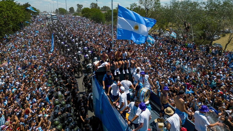 Argentina players on the open-top bus before the journey was sent to the skies of Buenos Aires