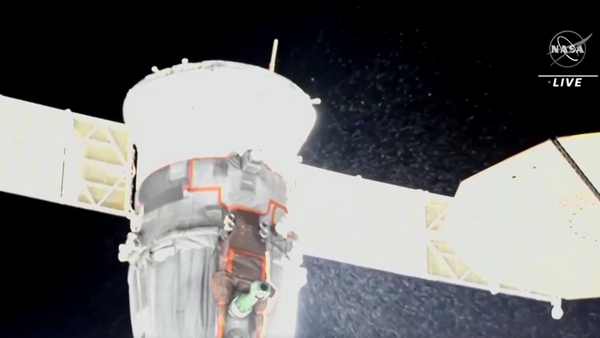 Nasa TV captured images of white snowflake-like particles streaming out of the capsule