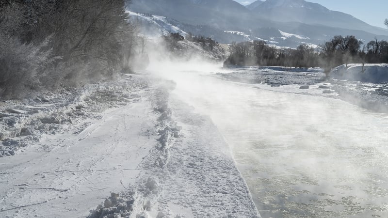 Mist rises above ice floes on the Yellowstone River in Paradise Valley, Montana as it freezes in record low temperatures