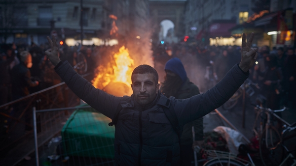 Protests erupted amid reports that the suspect faces charges over an earlier sabre attack on a migrant camp