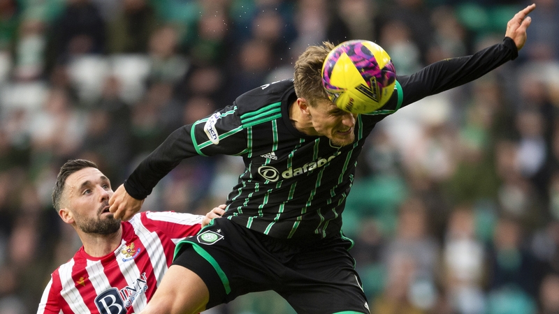 Celtic's Carl Starfekt and St Johnstone's Nicky Clark