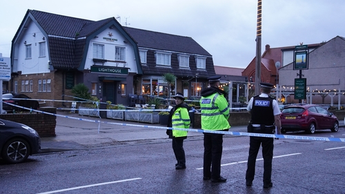Police officers outside the Lighthouse pub this morning