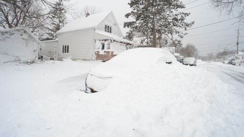 The extreme weather has stranded holiday travellerrs and trapped residents inside their homes