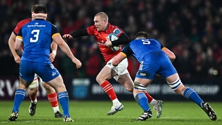 Keith Earls of Munster in action against Joe McCarthy of Leinster
