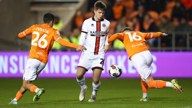 Sheffield United's James McAtee (centre) in action against Blackpool's Ian Poveda (left) and Sonny Carey