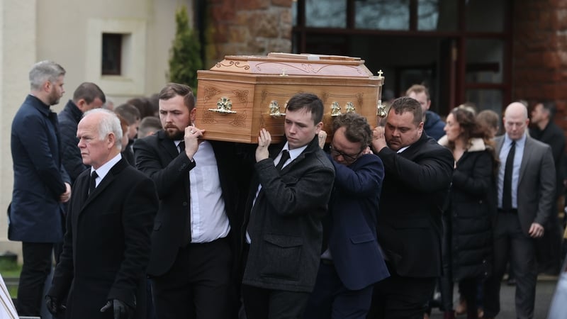 The coffin of Patrick Rogers is carried from his funeral service at St Joseph and St Malachy's Church, Drummullan
