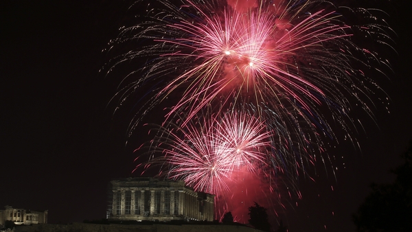 Fireworks explode over the ancient temple of Parthenon on the Acropolis hill of Athens, Greece during the new year's celebrations