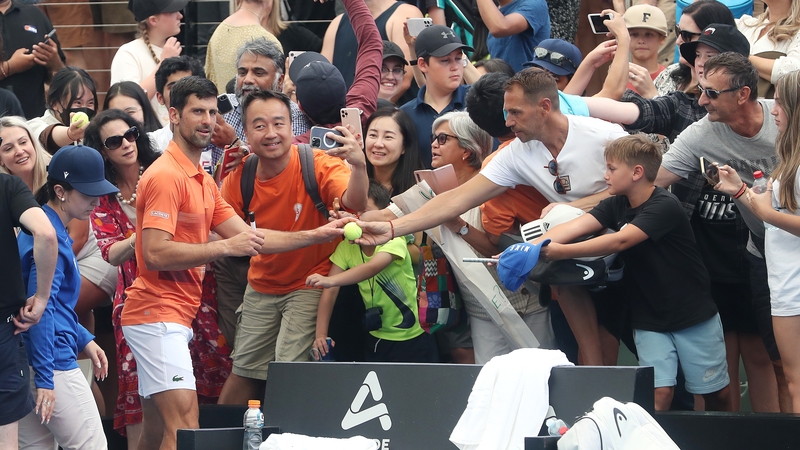 Novak Djokovic signs autographs at the Adelaide International