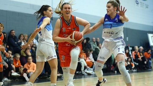 Michelle Clarke Killester (c) goes past Aine McKenna and Claire O Sullivan of The Address UCC Glanmire - pic courtesy of Martin Doherty Photography
